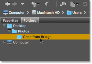 Clicking on a folder in the Folders panel to select it.