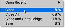 Choosing the Close command under the File menu in Photoshop CC. 