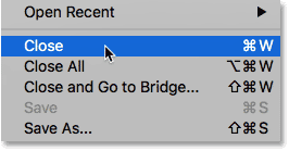 Choosing the Close command from under the File menu in Photoshop.