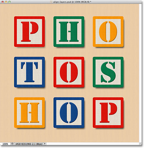 The blocks are now aligned horizontally with the Background layer and centered in the document. 