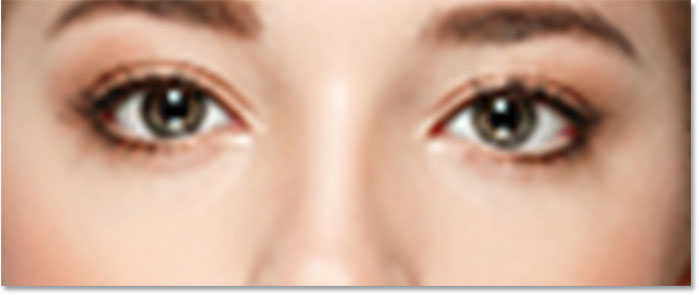 A close-up of the woman's eyes from the upscaled pixel version. 