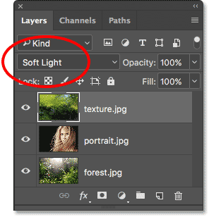 Changing the blend mode of the texture layer to Soft Light.