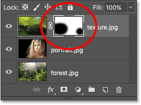 The layer mask thumbnail shows which areas of the layer are now hidden.